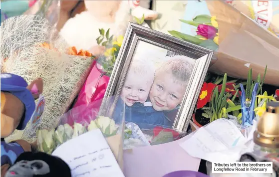  ??  ?? Tributes left to the brothers on Longfellow Road in February