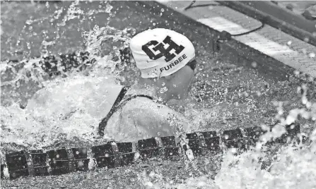  ?? GEOFF BLANKENSHI­P/COLUMBUS DISPATCH ?? Grandview Heights' Carrie Furbee touches the wall for a first-place finish in the 50 free at the Division II state meet Friday in Canton.