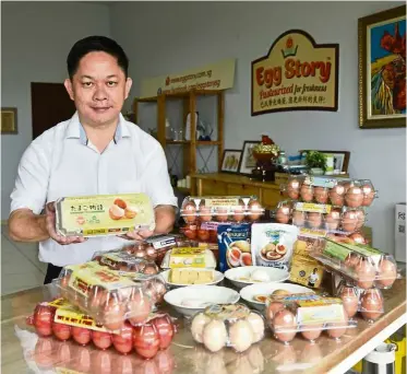  ??  ?? Major surplus:
Ma with some of the egg products by the company.
— The Straits Times/ann