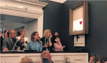  ?? Picture: Sky News ?? Banksy’s ’Girl with Balloon’ goes through the secret shredder after its auction at Sotheby’s.