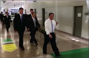  ?? AP ?? North Korean nuclear weapons negotiator Kim Yong Chol (right) walks through the Beijing airport in this video image taken Tuesday. He is scheduled to meet with Secretary of State Mike Pompeo later this week in New York.