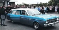  ?? PHOTO: RICHARD DAVISON ?? Last goodbyes . . . Mitchell McPhee, of Balclutha, was farewelled by family and friends during a service at the town’s South Otago Town &amp; Country Club yesterday.