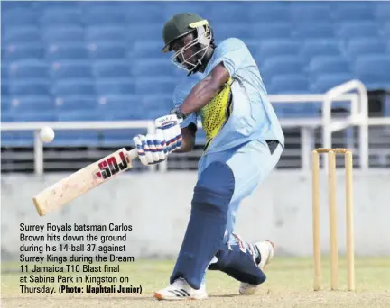  ?? (Photo: Naphtali Junior) ?? Surrey Royals batsman Carlos Brown hits down the ground during his 14-ball 37 against Surrey Kings during the Dream 11 Jamaica T10 Blast final at Sabina Park in Kingston on Thursday.