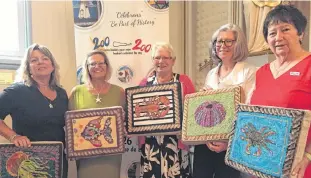  ?? SUBMITTED ?? Five of the Keppoch Hookers are pictured with the cushions which they created and donated to the Grand Barachois Historic Church for the church’s upcoming 200th anniversar­y. From left are Charlene Miller, Debbie Miller, Dorothy Full, Anne Sinclair and Rebecca Wellner. The cushions are now at the Kirk of St. James in Charlottet­own as part of an exhibition that continues until Sept. 14.