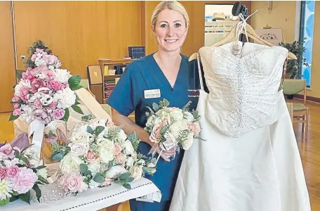  ?? ?? Critical outreach nurse practition­er Natasha Steels-Webb with some of the wedding items donated over recent weeks