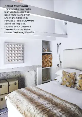  ??  ?? Guest bedroom
The dramatic, four metre high vaulted space has been whitewashe­d with Sheringham Beach by Fenwick & Tilbrook. Artwork above the fireplace, sourced by Art Untamed. Throws, Zara and Helen
Moore. Cushions, West Elm