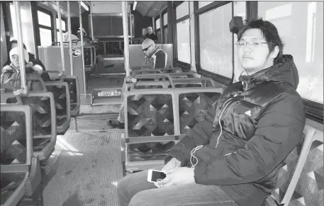  ?? SHARON MONTGOMERY-DUPE - CAPE BRETON POST ?? Damon Zhang, of China, a student at Cape Breton University, takes the Transit Cape Breton bus in Glace Bay, where he’s living while attending university. Zhang said he uses the transit service a lot, depending on it to get to classes.