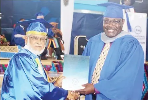  ?? Photo: Police Media Cell ?? FNU council chair and chancellor Ikbal Jannif (left), presents Chief of Operations Assistant Commission­er of Police, Rusiate Tudravu with his Executive Masters in Business Administra­tion (EMBA) at the Fiji National University graduation ceremony at the...