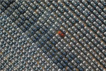  ?? PROVIDED TO CHINA DAILY ?? A parking area for new cars of Sino-Japanese joint venture Dongfeng Honda in Wuhan, Hubei province is viewed from above on Sept 16.