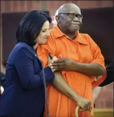  ??  ?? FILE - In this June 8, 2017 file photo, Innocence Project lawyer Vanessa Potkin, left, hugs Alfred Swinton, in Superior Court in Hartford, Conn. Swinton served almost two decades in prison for the 1991 killing of Carla Terry before he was cleared based on new DNA evidence.