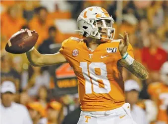  ?? STAFF PHOTO BY C.B. SCHMELTER ?? Tennessee freshman quarterbac­k Brian Maurer passes during the first half of Saturday night’s game against Georgia at Neyland Stadium.