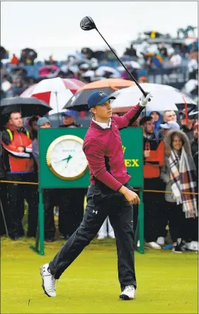  ?? STUART FRANKLIN — GETTY IMAGES ?? Jordan Spieth has an awkward follow through on his tee shot at the 15th hole, but he recovered to make eagle at the par-5 on the way to the second-round lead.