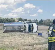  ?? Contribute­d photo ?? This overturned tanker spilled jet fuel at Tweed New Haven Airport.