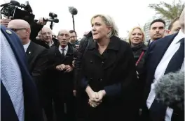  ??  ?? NICE: French presidenti­al election candidate for the far-right Front National (FN) party Marine Le Pen (C) walks on the “Promenade des Anglais” as she visits Nice. — AFP