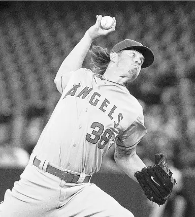  ?? CHRIS YOUNG / THE CANADIAN PRESS ?? Los Angeles pitcher Jered Weaver allowed four hits, three earned runs and three walks
on Wednesday night to help the Angels to their seventh win in the last nine games.
