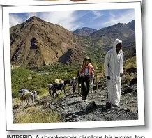  ??  ?? INTREPID: A shopkeeper displays his wares, top, and, below, seasonal hikers in the mountains