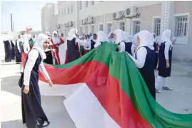  ??  ?? Students of Al Amal School celebratin­g the National Day in Barka on Sunday.