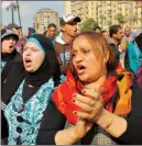  ??  ?? Egyptian women shout anti-Mohammed Morsi slogans during a protest Saturday in Cairo.
