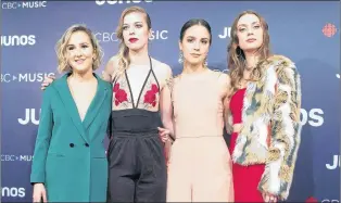  ?? CP PHOTO ?? Jordan Miller, second right, stands with her “The Beaches” as they arrive at the Juno Awards in Vancouver, Sunday, March, 25, 2018. The closest singer and guitarist Jordan Miller gets to courtship these days is mingling with fellow singletons on Tinder...