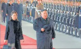  ?? AP ?? North Korean leader Kim Jong Un walks with his wife Ri Sol Ju at Pyongyang Station before leaving for China. Kim arrived in Beijing on Tuesday for his fourth summit with Chinese President Xi Jinping.