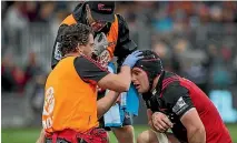  ??  ?? Matt Todd is tested for concussion during a Crusaders-Highlander­s match.