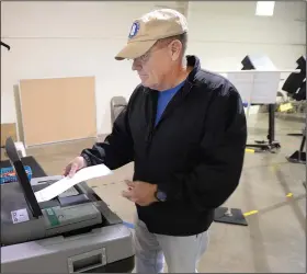  ?? (NWA Democrat-Gazette/Andy Shupe) ?? Mike Brinson of Elkins casts his ballot Tuesday at the First Baptist Church of Elkins after voting in a primary special election for Senate District 7.