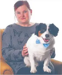  ??  ?? Susan Shaw, who died in the collision, pictured with her dog Smudge. Right: Floral tributes left at the scene on High Street, Rishton