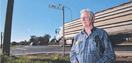  ?? Picture: Nev Madsen ?? SAFETY ISSUE: Geoff Adams is concerned about the safety of the New England Highway and Hi Winds Rd intersecti­on.