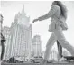  ?? ALEXANDER NEMENOV/GETTY-AFP ?? A woman walks past the Russian Foreign Ministry in Moscow.