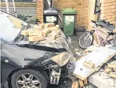  ?? PHOTOS: MARK CONDREN ?? Carnage: Clockwise from main: the damage to the front of the house on St Aongus Road, Tallaght, Dublin; bricks lie on the car after the crash; the car is removed from the scene; and Liam Kenny surveys the damage at his daughter’s house.