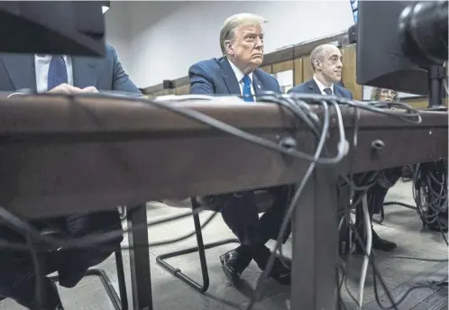  ?? ?? Donald Trump ahead of yesterday’s hearing in his criminal trial at Manhattan Criminal Court, where the press were out in force, below