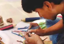  ?? AFP ?? Asif works on his pencils artwork at his studio in Karachi.