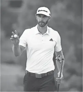  ?? YALONDA M. JAMES THE COMMERCIAL APPEAL ?? Dustin Johnson waves to the crowd after finishing his day 10-under at the FedEx St. Jude Classic on Friday.