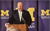  ?? Dale G. Young / Associated Press ?? Michigan athletic director Warde Manuel smiles during a news conference in 2016 at the Student Union in Ann Arbor, Mich.