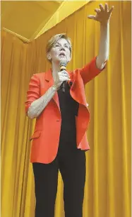  ?? STAFF PHOTO BY PATRICK WHITTEMORE ?? HUB FORUM: U.S. Sen. Elizabeth Warren, above, slammed President Trump’s tax cuts yesterday at a town hall event, top photo, at the Benjamin Franklin Institute of Technology.