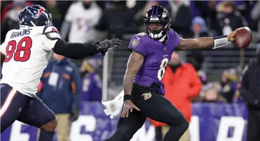  ?? GETTY IMAGES ?? Lamar Jackson accounted for four touchdowns for the Ravens. Baltimore will host the AFC title game for the first time since the Colts did it in January 1971.