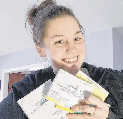  ??  ?? Nicole Turple holds a four-month supply of Symdeko, a medication for cystic fibrosis, that was gifted to her by Mark and Kelly Lindsay recently. The Lindsays gave Turple the medication after their 23-year-old daughter Chantelle passed away from the genetic disorder on Feb. 19.