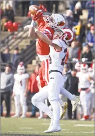  ?? H John Voorhees III / Hearst Connecticu­t Media ?? New Canaan’s Charlie Cunney (24) knocks away a pass intended for Greenwich’s Lance Large on Saturday morning.