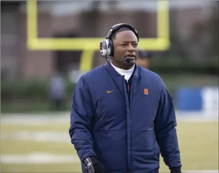  ?? BEN MCKEOWN ?? Syracuse head coach Dino Babers walks the sideline during an NCAA college football game against Duke in Durham, N.C., Saturday, Nov. 16, 2019. Babers enters his fifth year at the helm often repeating a phrase he despises: “I don’t know.” Such is life during a pandemic, when an invisible foe can alter a lineup in the blink of an eye. Less than two weeks before the season opener, Babers is trying to mold his team while also assuaging any fears the players voice regarding both the novel coronaviru­s and the racial tension across America.