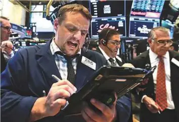  ?? AP ?? The New York Stock Exchange. The Dow Jones Industrial Average is bobbing close to 10 per cent correction territory, compared with its January 26 high.