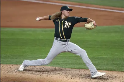  ?? RICHARD W. RODRIGUEZ — THE ASSOCIATED PRESS ?? Oakland Athletics relief pitcher Jordan Weems (70) works the sixth inning against the Texas Rangers Sept. 12, 2020in Arlington, Texas.