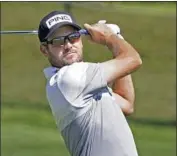  ?? John Raoux Associated Press ?? COREY CONNERS HITS his approach shot from the 16th fairway. He eagled the hole and leads by one.