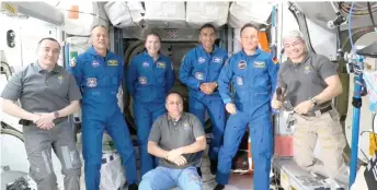  ?? — AFP photo ?? This Nasa TV frame grab image captured shows the crew of the Internatio­nal Space Station (from left) Anton Shkaplerov, Marshburn, Barron, Chari, Maurer, Mark Vande Hei and (sitting) Pyotr Dubrov, after Crew-3 sucessfull docking.