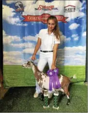  ?? PHOTO PROVIDED ?? Natasha Czizik, a Saratoga Springs High School graduate entering her second year at SUNY Cobleskill this fall, won Saratoga County Fair’s 4-H Goat Show with Georgiana from Vincek’s Farm in Wilton. Czizik was Champion Showman and won the Grand Champion Animal award. She is majoring in animal science.