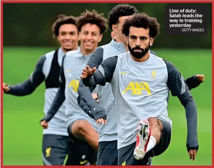  ?? GETTY IMAGES ?? Line of duty: Salah leads the way in training yesterday