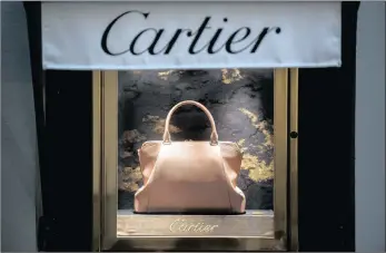  ??  ?? A handbag on display at a Cartier luxury store operated by Richemont in Lugano, Switzerlan­d. Richemont has improved its performanc­e in the Asia-Pacific region, driven by strong growth in the Jewellery Maisons.