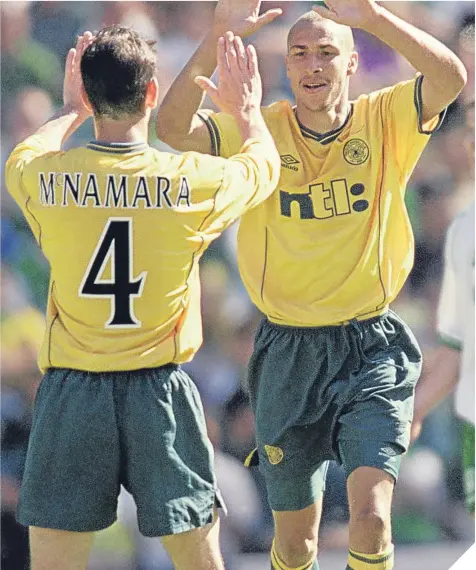  ??  ?? ■ McNamara celebrates with fellow scorer Henrik Larsson during the 2001 Scottish Cup Final success.