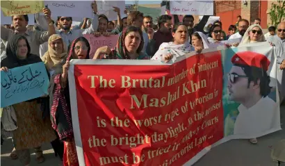  ?? AP ?? Activists of a Pakistani civil society organisati­on protest against the killing of Mashal Khan during a rally in Peshawar. —