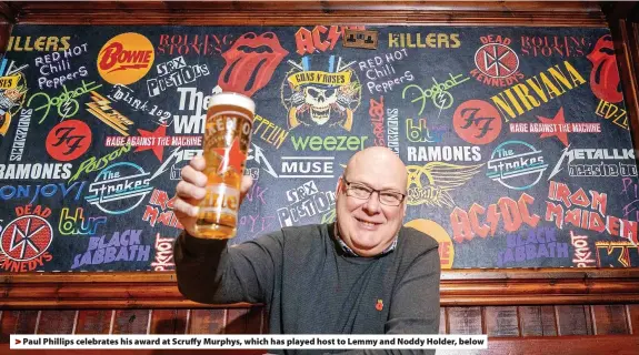  ?? ?? > Paul Phillips celebrates his award at Scruffy Murphys, which has played host to Lemmy and Noddy Holder, below
