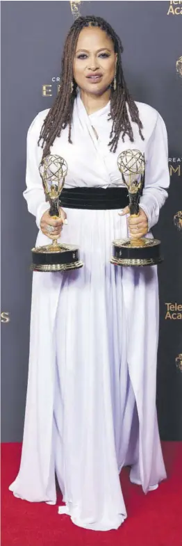  ?? (Photo: AP) ?? Queen Sugar creator Ava Duvernay poses in the press room with the awards for Outstandin­g Documentar­y or Nonfiction Series, and for Outstandin­g Writing for a Non-fiction Programme for 13th during night one of the Creative Arts Emmy Awards in Los Angeles on September 9, 2017.